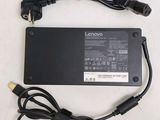 a close up of a laptop charger on a white surface