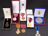 several medals and medals are displayed in a display case