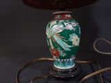 a lamp that is sitting on a table next to a lamp shade