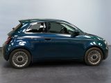 a picture of a small blue car parked in a garage