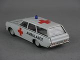 a toy ambulance car with a red cross on top