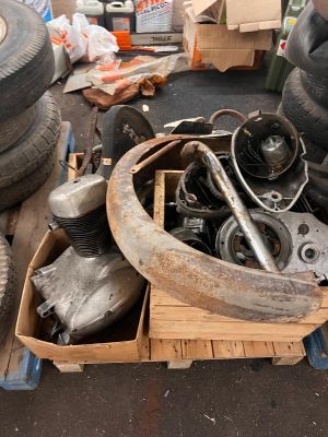 a pile of old tires and other junk on the ground
