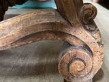 a close up view of a wooden table with a metal base