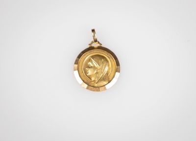 l'image d'une pièce d'or sur laquelle figure le visage d'une femme