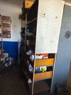 a tall cabinet with drawers in the middle of a room