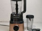 a blender that is sitting on a table next to a blender