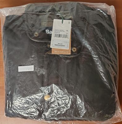 the shirt is wrapped in plastic and ready to be shipped