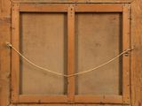 an old wooden window with a rope hanging from it ' s side