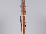 an old bassoon on display in a glass case