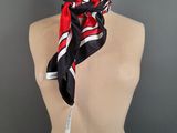 a mannequin torso with a red and black scarf on it