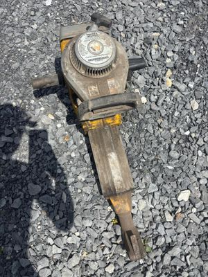 a fire hydrant laying on the ground with a shadow of a person