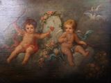 un tableau représentant deux chérensils accroché au mur
