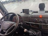 dashboard of a bus with steering wheel and dashboard controls