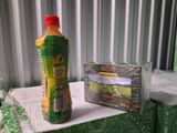 a bottle of orange juice next to a package of orange juice