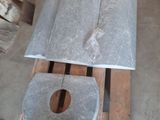 two pieces of concrete sitting on a pallet in a warehouse