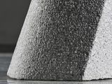 a close up of a piece of concrete on the floor