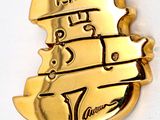 a gold plated necklace with a violin on it