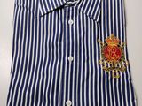 a blue and white striped shirt with a crest on the chest