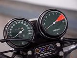 two gauges on the handlebars of a motorcycle