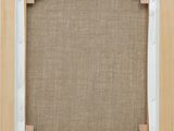 a close up of a wooden frame with a brown background