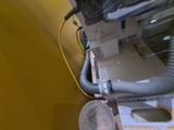a machine that is sitting next to a yellow wall