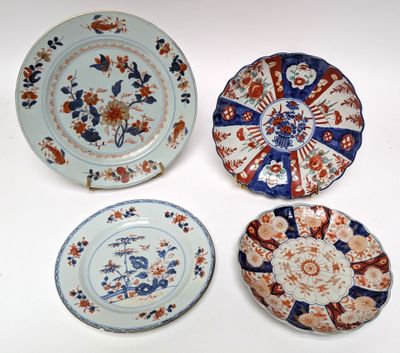 three plates with different designs on them sitting on a white surface