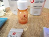 a bottle of skin therapy and a tube of lotion sitting on a table