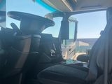 a view of the inside of a vehicle from the driver ' s seat