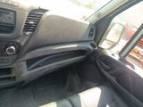 a dashboard of a car with a steering control