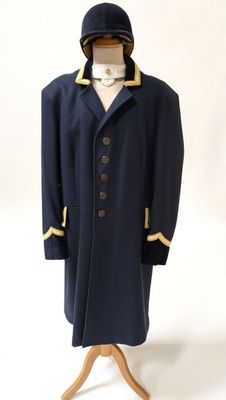 an image of a man ' s coat on a mannequin stand
