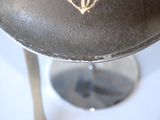 a close up of a helmet on a stand