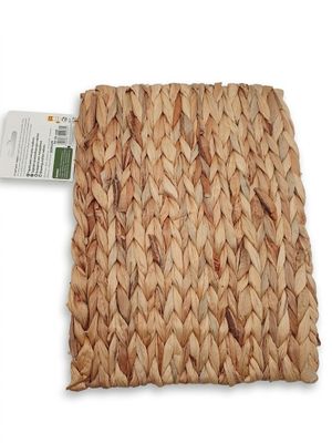woven square placemat with a tag on top of it
