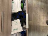 a drawer full of toiletries and cleaning supplies