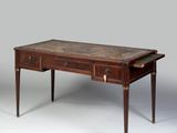 an old wooden table with two drawers and a drawer underneath it