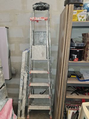 a ladder that is leaning against a wall in a room