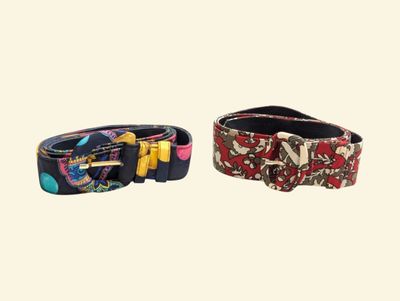 two belts with bows and bows on them on a white background