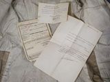 a piece of paper that is laying on top of a jacket