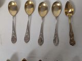 a lot of spoons that are sitting on a table