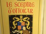 une image représentant un livre sur lequel figure l'effigie d'un homme dans un blason