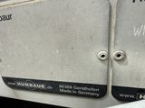 a close up of a metal door with a number on it