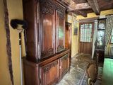 a large wooden cabinet in the middle of a room