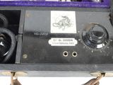 an old fashioned radio sitting in a case on a table