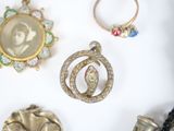 a picture of a collection of jewelry on a white surface