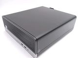 an image of a small black computer sitting on top of a white surface