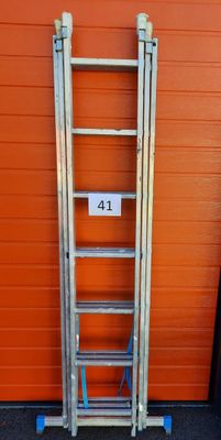 a ladder that is leaning against a wall with a number 41 on it