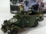 a toy army vehicle with a soldier on top of it