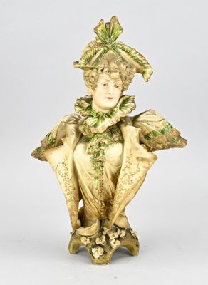 statue of a woman in a green dress with a hat on her head