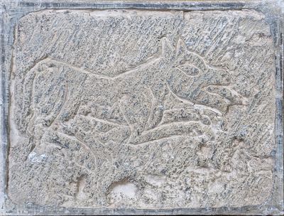 relief of a lion and a lioness on a stone block