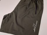 a close up of a pair of shorts on a white table