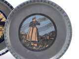 two plates with a picture of a woman and a man on them